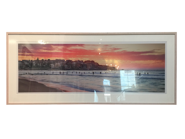 A very large photo of Bondi beach framed in a Tasmanian oak box frame with UV glass and a mat board surround.