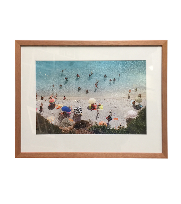 A picture of people bathing at Bondi beach framed in a raw Tasmanian oak frame with a mat board surround.
