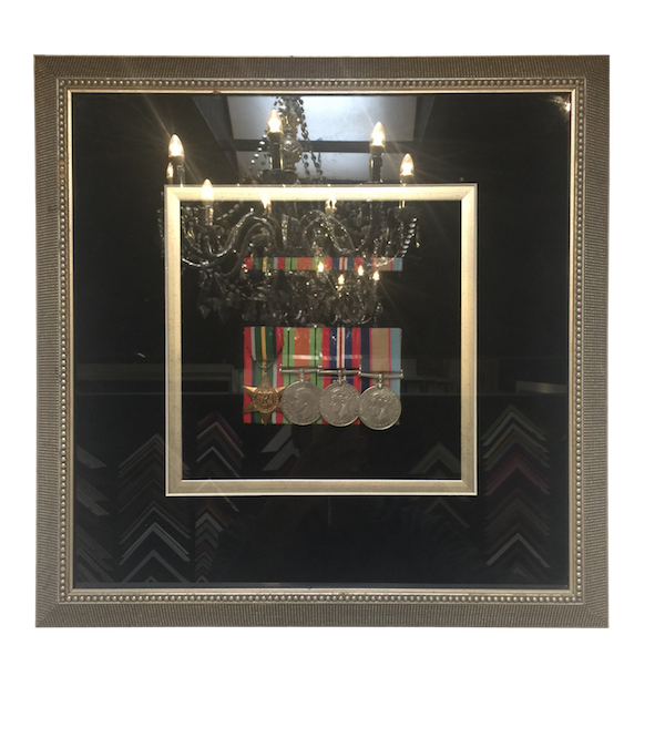 Greg Mahoneys fathers medals framed in a silver Bellini frame with a suede mat board surround and an inner silver fillet.
