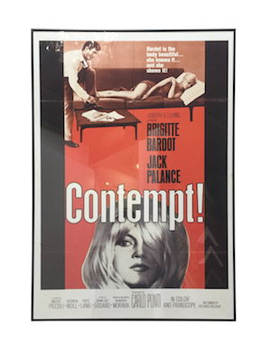 A vintage movie poster framed in a black aluminium frame with perspex.