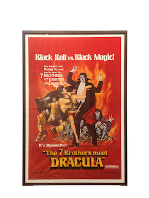 A large vintage Dracula movie poster framed in a stained Tasmanian oak box frame with perspex.