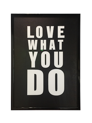 A motivational poster framed in a black gloss timber frame with non reflecting Art glass.