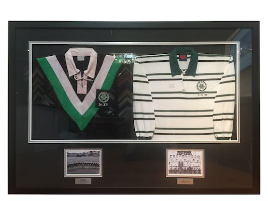 Father and son jerseys framed side by side with photographs and plaques in a deep black timber box frame with triple mat board surround and perspex, which we delivered to Brisbane.