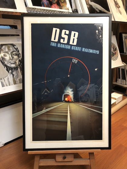 A large Danish Railway print framed in a black box frame with a white mat board surround and acrylic front.
