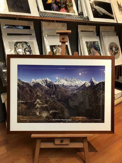 A print of Mt Everest framed in a Walnut frame with a mat board surround and glass.