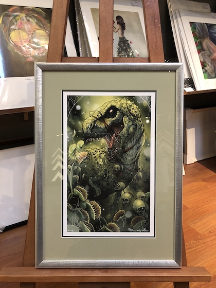 A T-Rex print framed in a silver frame with double mat boards and UV glass.