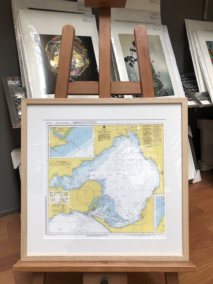 A map of Port Phillip Bay framed in a Tasmanian oak frame with mat board surround and UV glass.