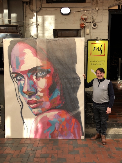 A super large figurative painting stretched on canvas with strong bracing.