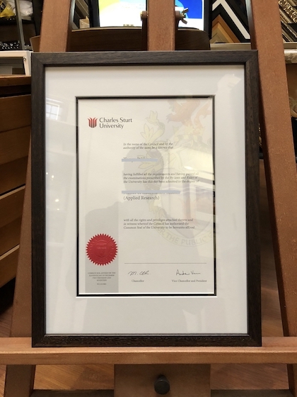 A Charles Sturt University certificate framed in a stained Tasmanian oak frame with double mat boards and UV glass.