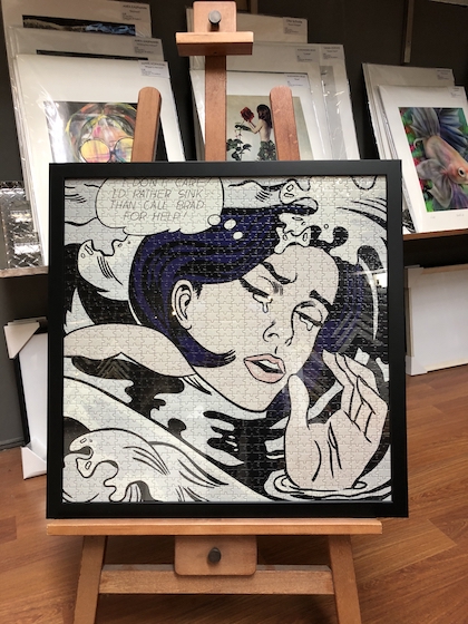 A classic Lichtenstein jigsaw puzzle framed in a black timber frame.