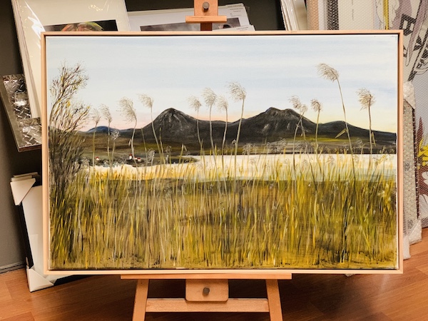 An original landscape country painting stretched and framed in a Tasmanian oak floater frame.