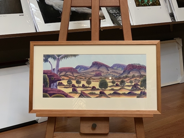 A Namatjira watercolour painting framed in a blackwood box frame with mat board surround and UV glass.