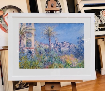 This is a lovely Monet print in a contemporary white frame and mat surround with glass