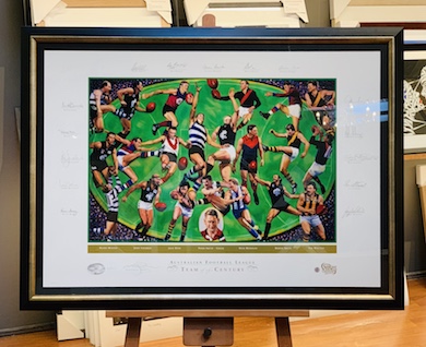 A magnificent limited edition print of the AFL Team of the Century. The frame is black and silver with a black mat surround and museum glass