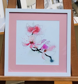 A beautiful little watercolour framed with a white frame and pink mat surround