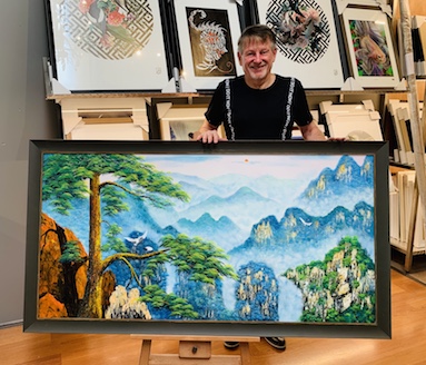 A large Chinese painting that we have stretched on to a timber stretcher frame and then framed in a beautiful curved frame