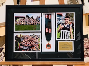 A collage of photos with a premiership medal and plaque that we framed in a black frame with a double mat surround