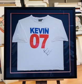 A signed Kevin 07 T-Shirt from the 2007 election which we have framed with a double mat surround and mat backing with a black frame and UV glass to protect the signature from fading