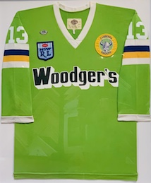 A large Woodgers jersey with a white mat board backing, white frame and glass