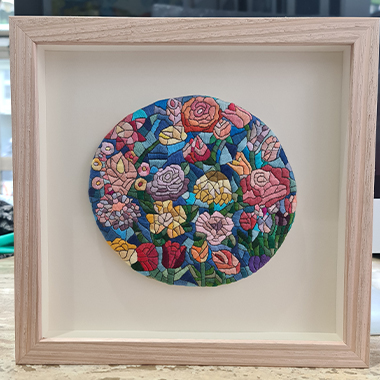 A client with a beautiful flower tapestry requested that this art piece be framed in a raw oak custom frame and floated on a 3mm foam core for the floating effect. This frame design turned this art piece into a unique and elegant framed artwork.